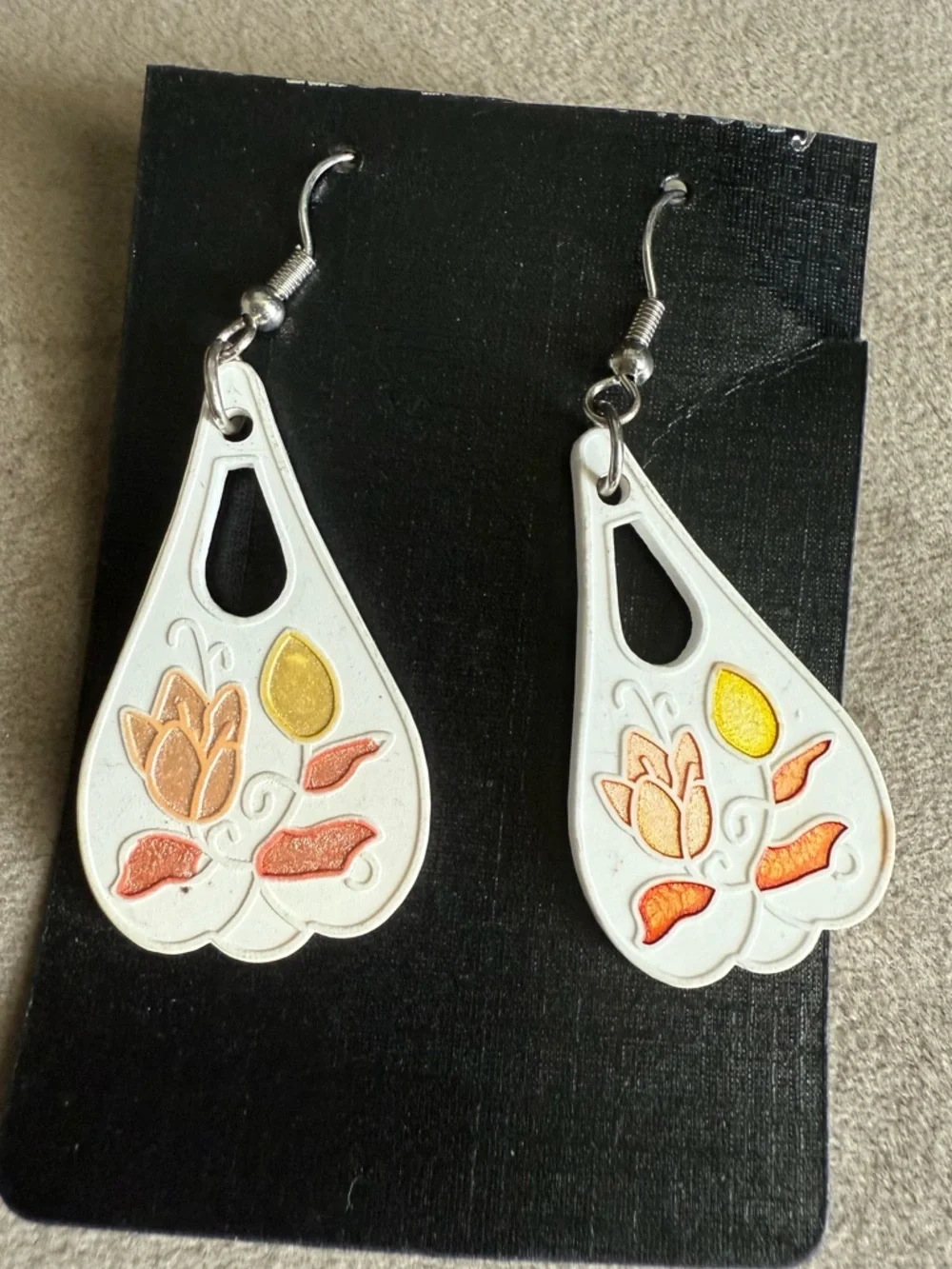White Floral Teardrop Earrings with Orange and Gold Accents